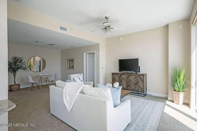 a large kitchen with kitchen island granite countertop a large window