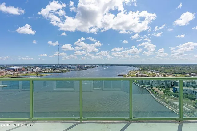 a bathroom with a sink a mirror and a shower