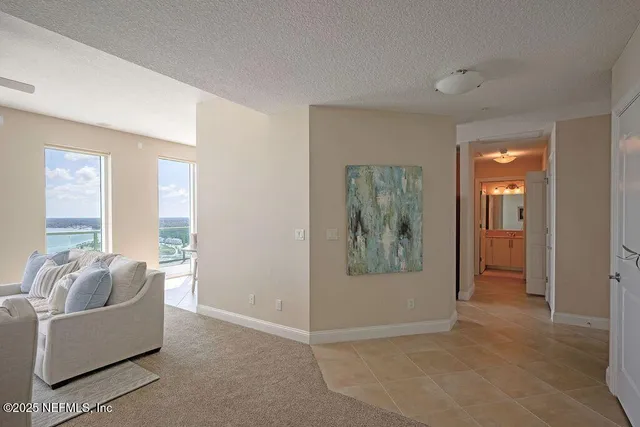 a living room with fireplace furniture and a flat screen tv