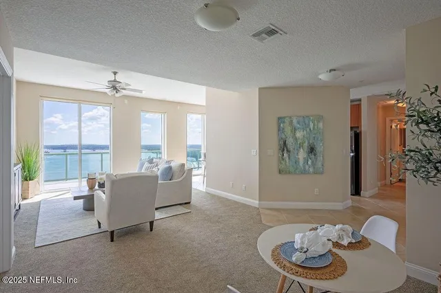 a view of a swimming pool and an outdoor seating