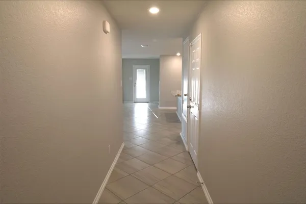 a view of a hallway with a white walls