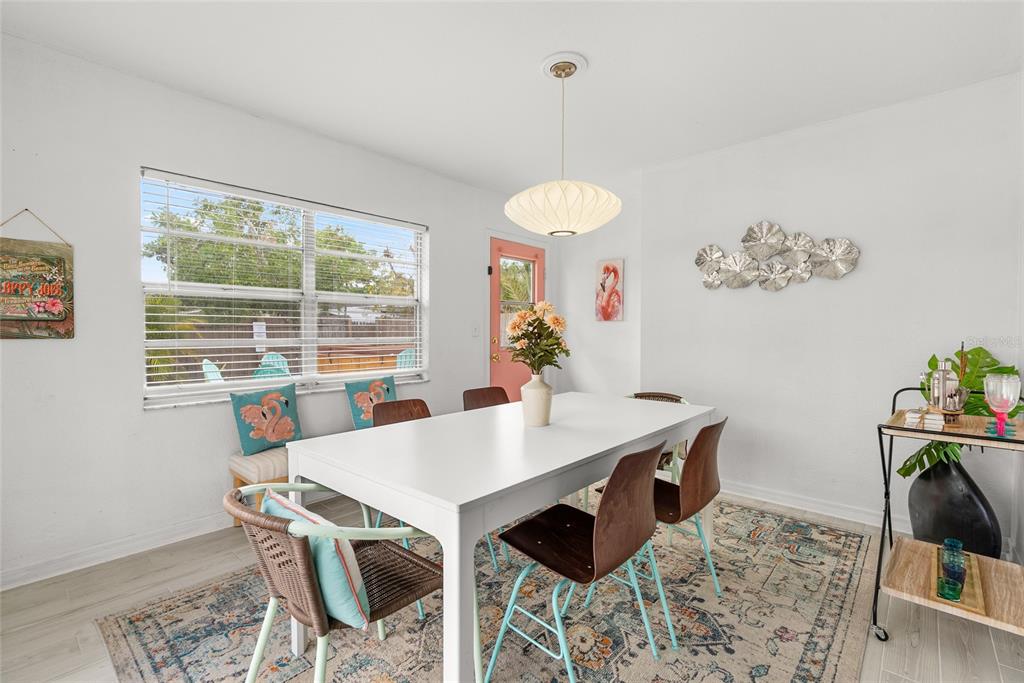 4939 100th Way North St. Petersburg, FL 33708 - Photo 13 of 43 a view of a dining room with furniture window and outside view
