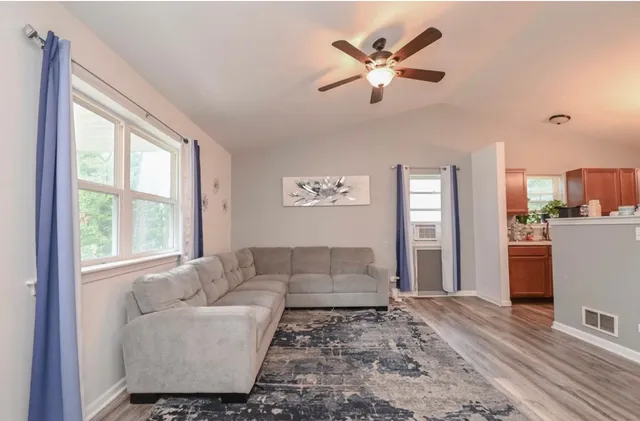 a living room with furniture and window
