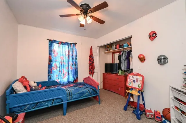 a bedroom with furniture and a chandelier
