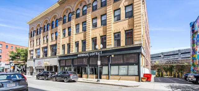 a view of tall building on the street