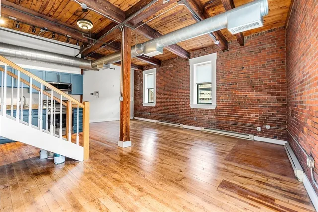 a view of a balcony with wooden floor