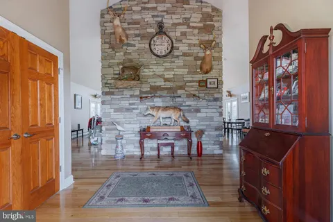 a view of an entryway with wooden floor