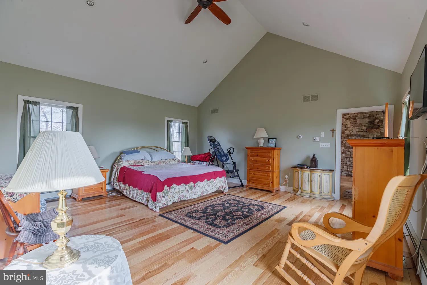 33487 Galena Sassafras Road Galena, MD 21635 - Photo 27 of 59 a bedroom with a bed and wooden floor