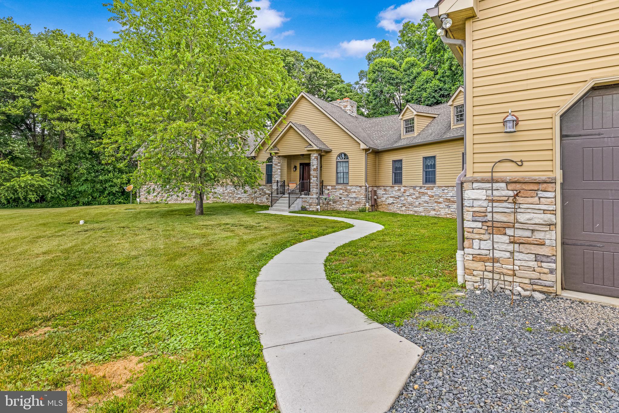 33487 Galena Sassafras Road Galena, MD 21635 - Photo 36 of 59 a view of a house with a yard and a garden