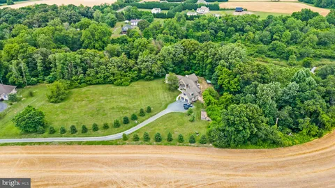 a view of a swimming pool and a yard