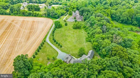 a view of a swimming pool with a yard