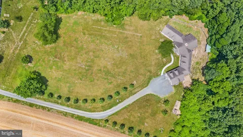a view of a swimming pool with a yard
