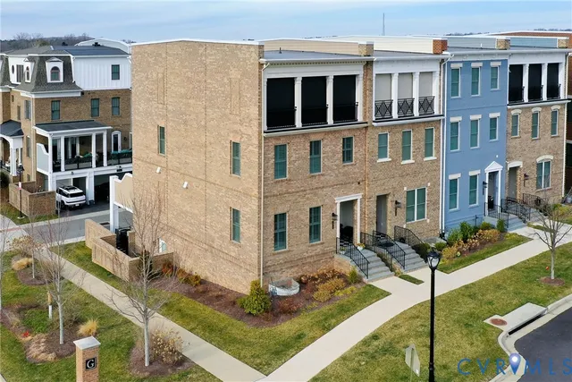a front view of a building with a yard