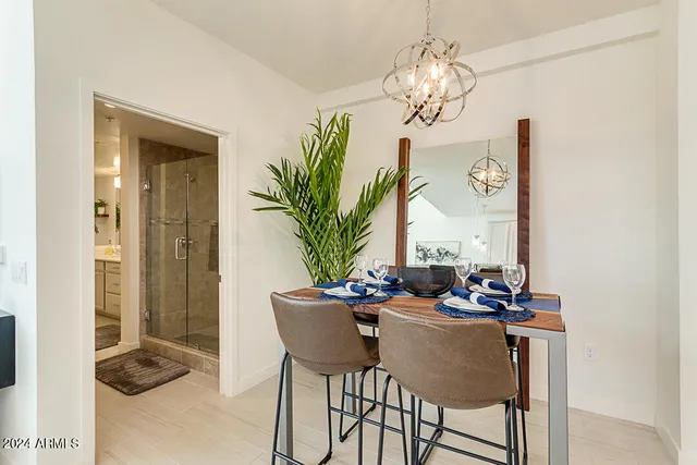 a dining room with furniture and window
