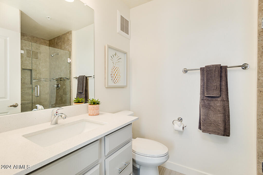 2511 West Queen Creek Road, Unit 416 Chandler, AZ 85248 - Photo 24 of 30 a bathroom with a sink toilet and shower