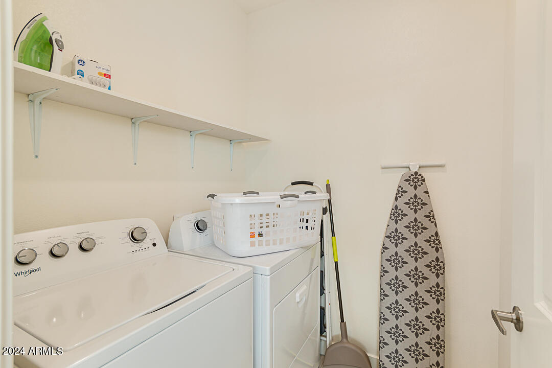 2511 West Queen Creek Road, Unit 416 Chandler, AZ 85248 - Photo 26 of 30 a utility room with dryer and washer