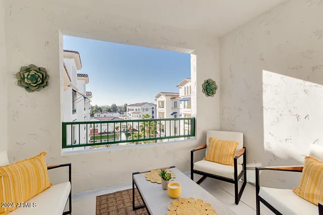 a balcony with seating space