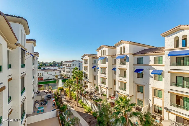 a view of a blue building with many windows