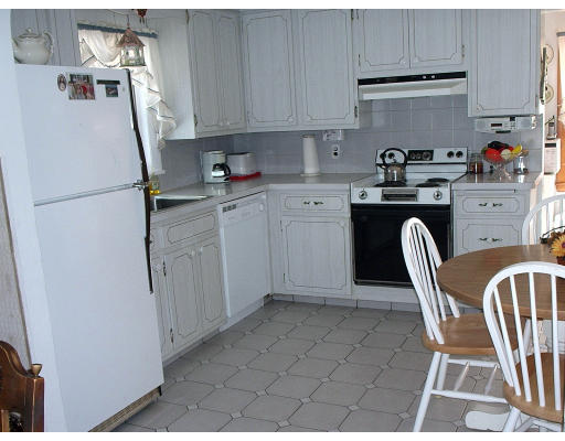 133 Fern Road Medford, MA 02155 - Photo 14 of 23 a kitchen with stainless steel appliances granite countertop a refrigerator sink and cabinets
