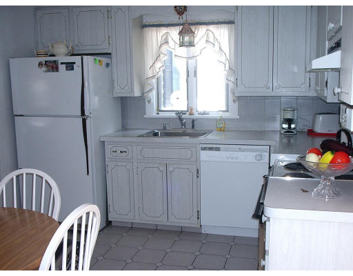 133 Fern Road Medford, MA 02155 - Photo 15 of 23 a kitchen with stainless steel appliances a refrigerator sink and cabinets