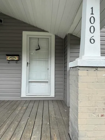 a view of a wooden door of a house