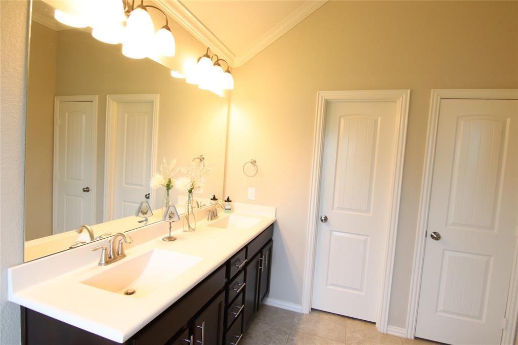 6719 Rambling Manor Court Richmond, TX 77469 - Photo 17 of 26 a bathroom with a sink double vanity and a mirror