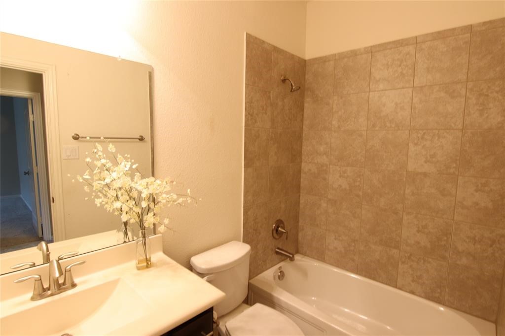 6719 Rambling Manor Court Richmond, TX 77469 - Photo 21 of 26 a bathroom with a sink and a mirror