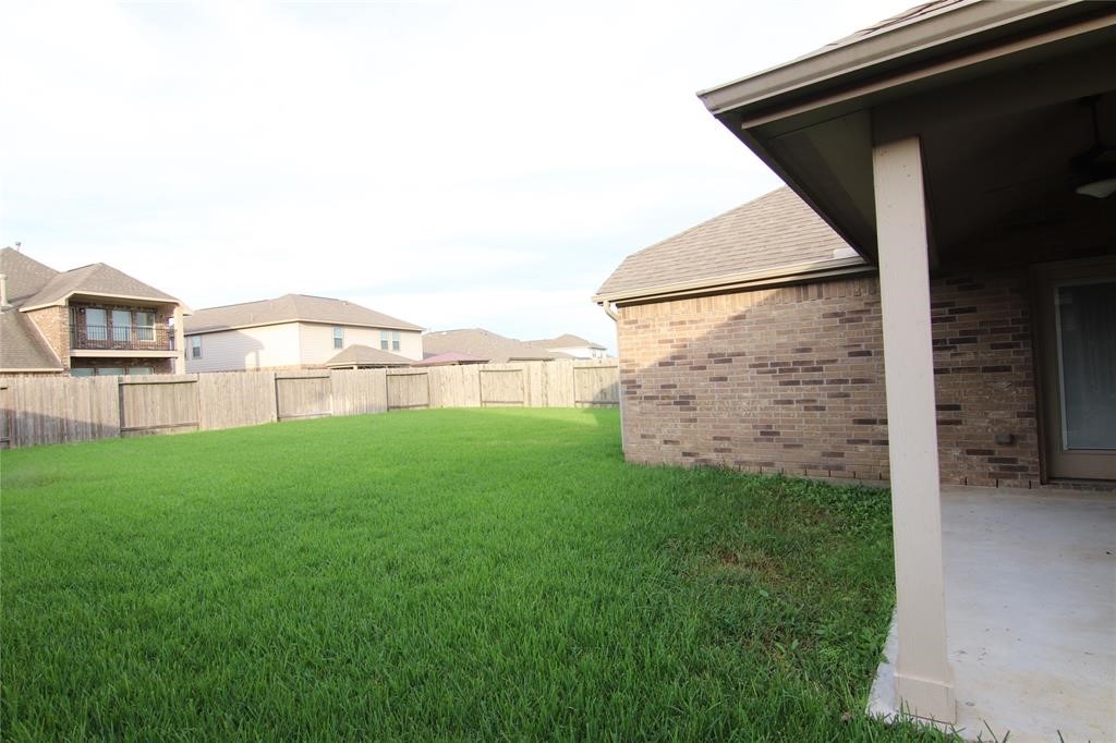 6719 Rambling Manor Court Richmond, TX 77469 - Photo 23 of 26 a view of a yard in front of a house