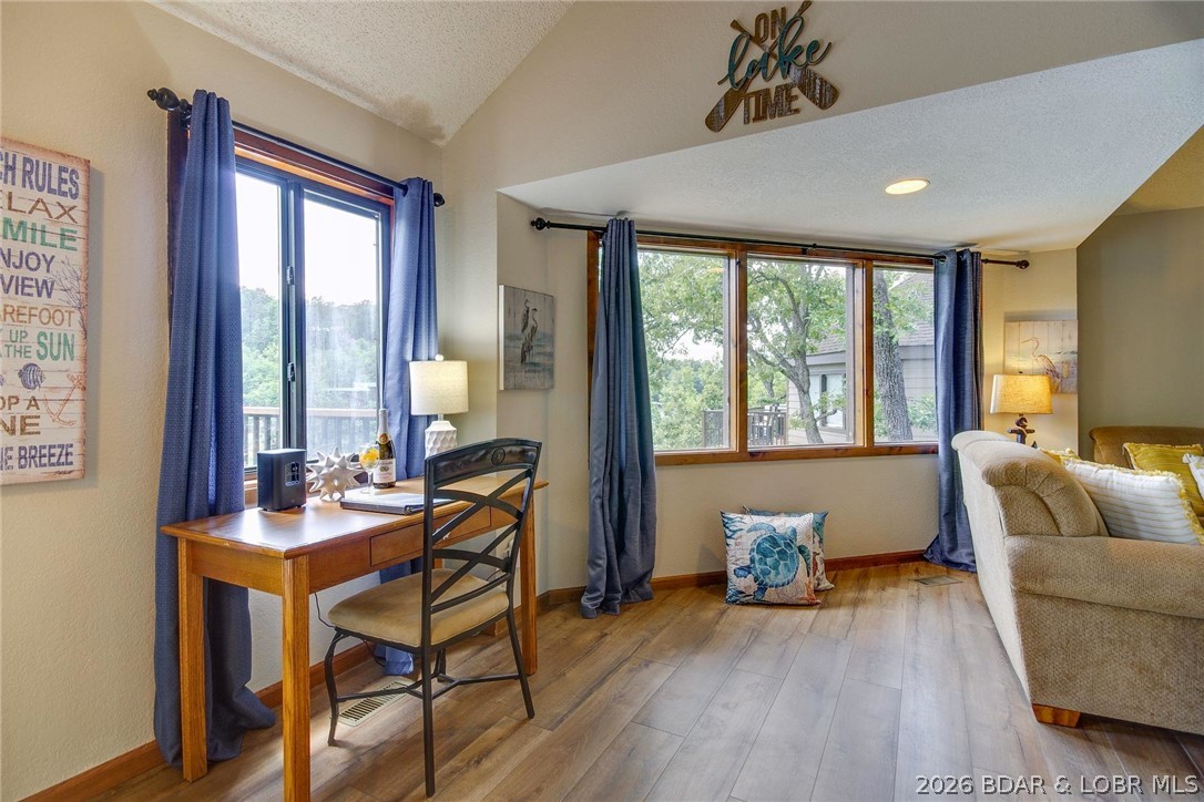 1082 Rachel Road, Unit 29 Osage Beach, MO 65065 - Photo 5 of 32 Lot's of windows overlooking the lake.