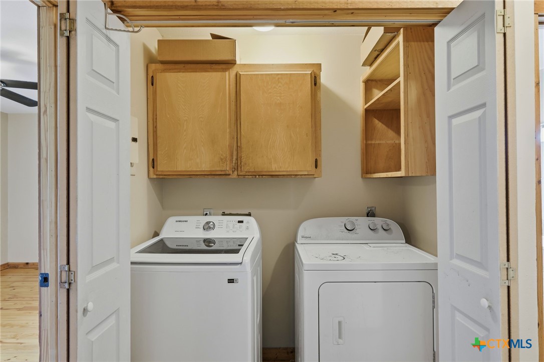 903 Summit Street Round Rock, TX 78664 - Photo 16 of 38 Downstairs Laundry closet with lots of room for storage for the laundry and cleaning supplies.