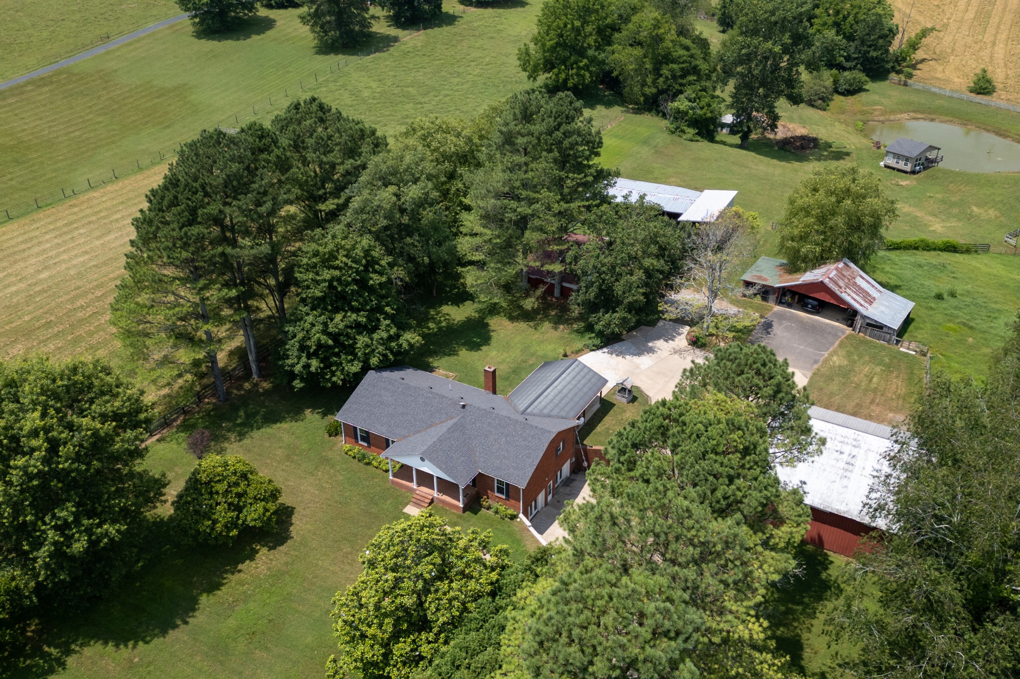 an aerial view of a house with garden space and street view