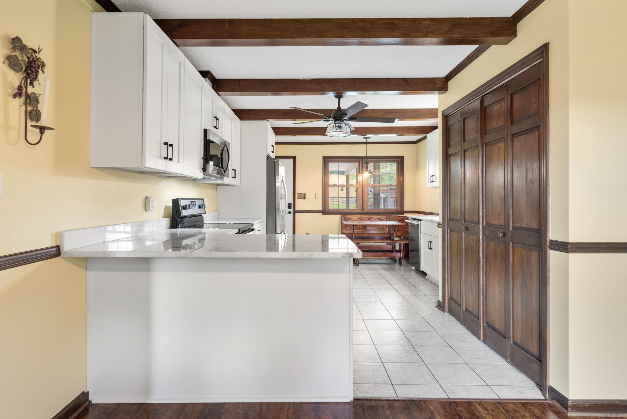 719 Waco Road Lynnville, TN 38472 - Photo 13 of 67 a kitchen with stainless steel appliances granite countertop a sink and cabinets