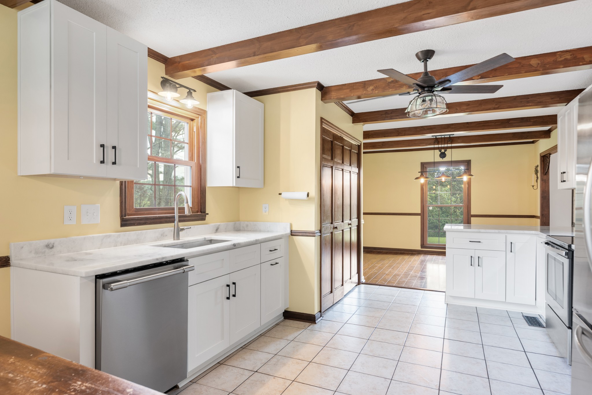 719 Waco Road Lynnville, TN 38472 - Photo 17 of 67 a kitchen with stainless steel appliances granite countertop a sink and cabinets