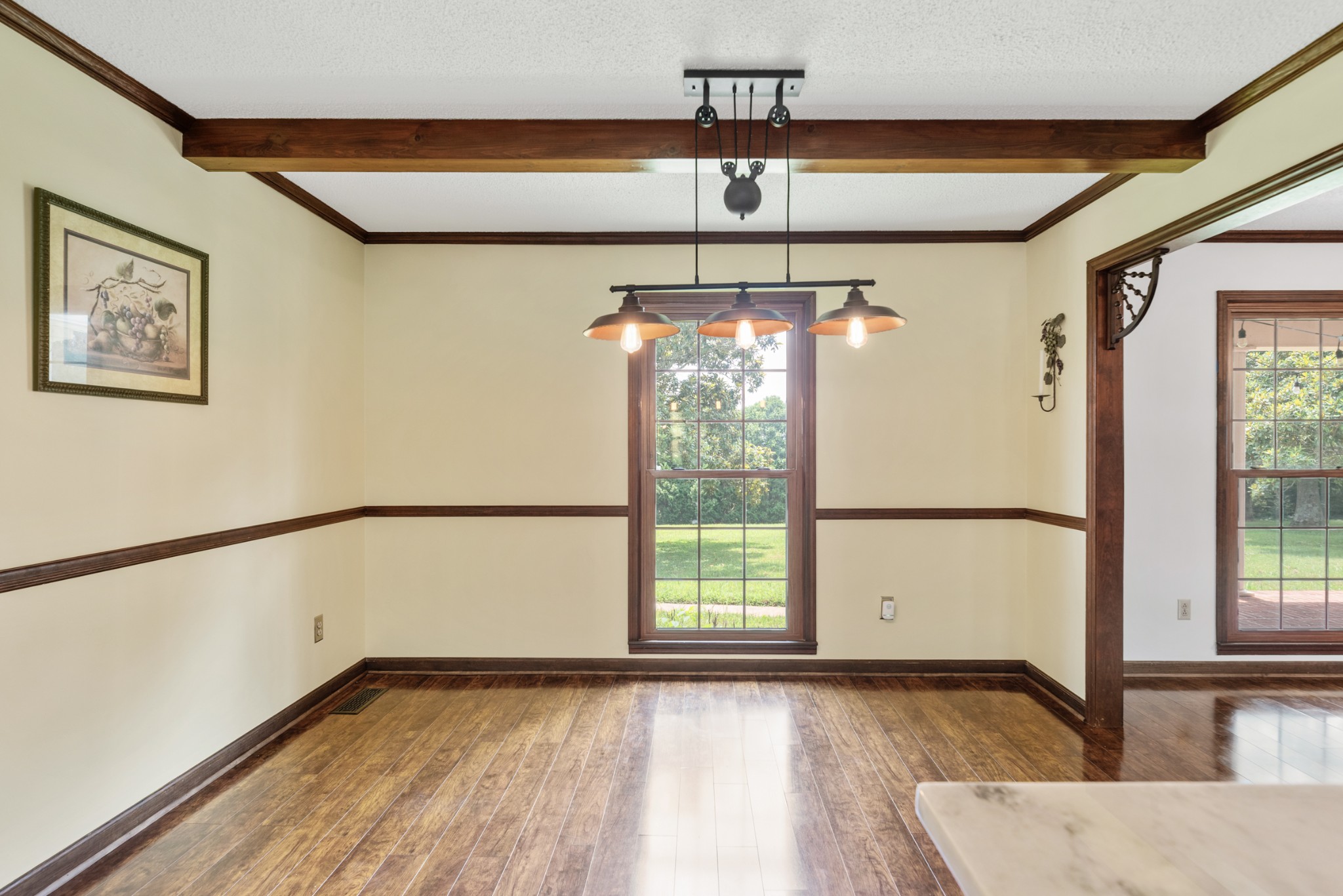 719 Waco Road Lynnville, TN 38472 - Photo 19 of 67 a view of an empty room with a window and wooden floor