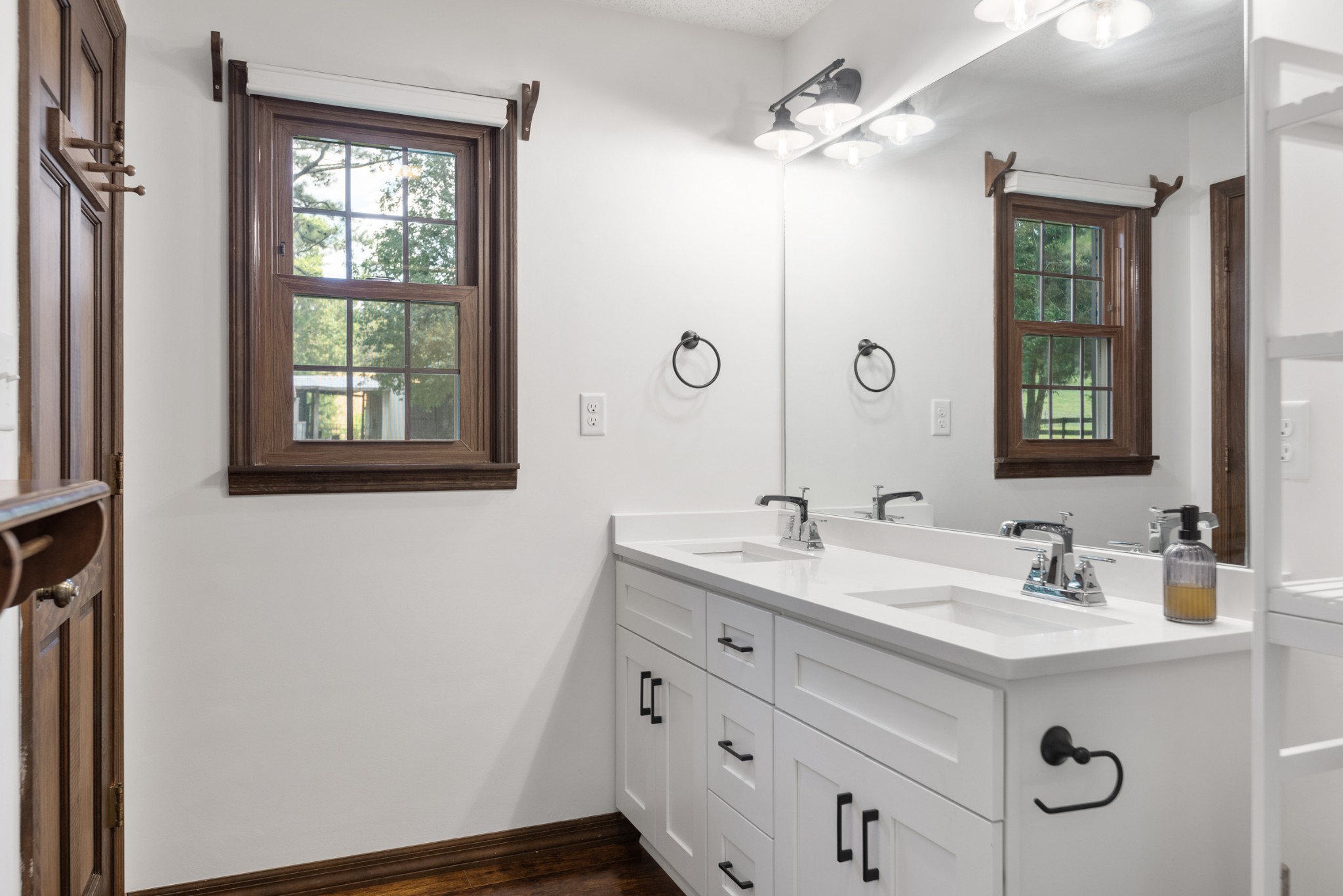 719 Waco Road Lynnville, TN 38472 - Photo 26 of 67 a bathroom with a sink double vanity and a mirror
