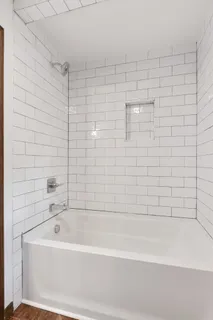 a kitchen with stainless steel appliances a refrigerator and a stove