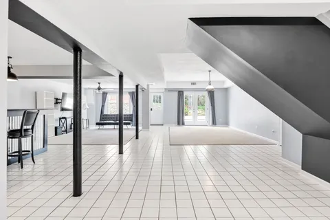 a bathroom with a double vanity sink toilet and shower
