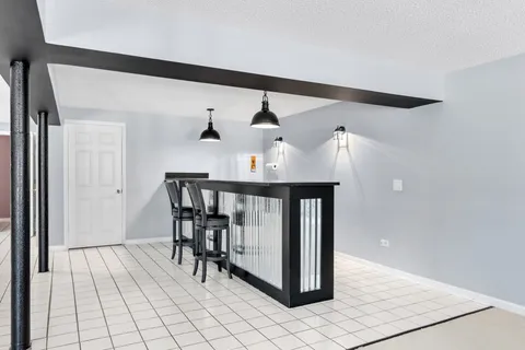 a front view of a house with a garden and porch