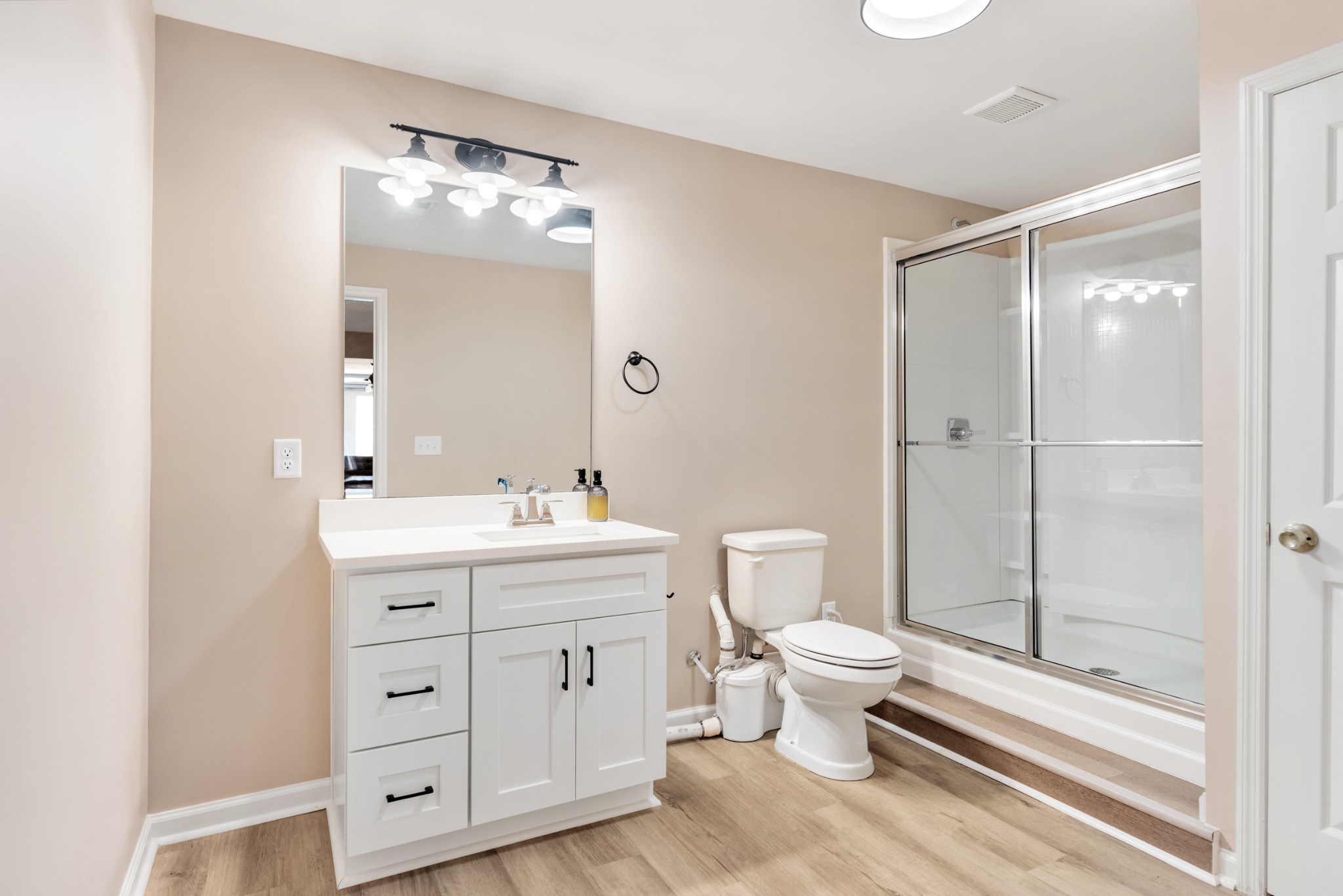 719 Waco Road Lynnville, TN 38472 - Photo 41 of 67 a bathroom with a double vanity sink toilet and shower
