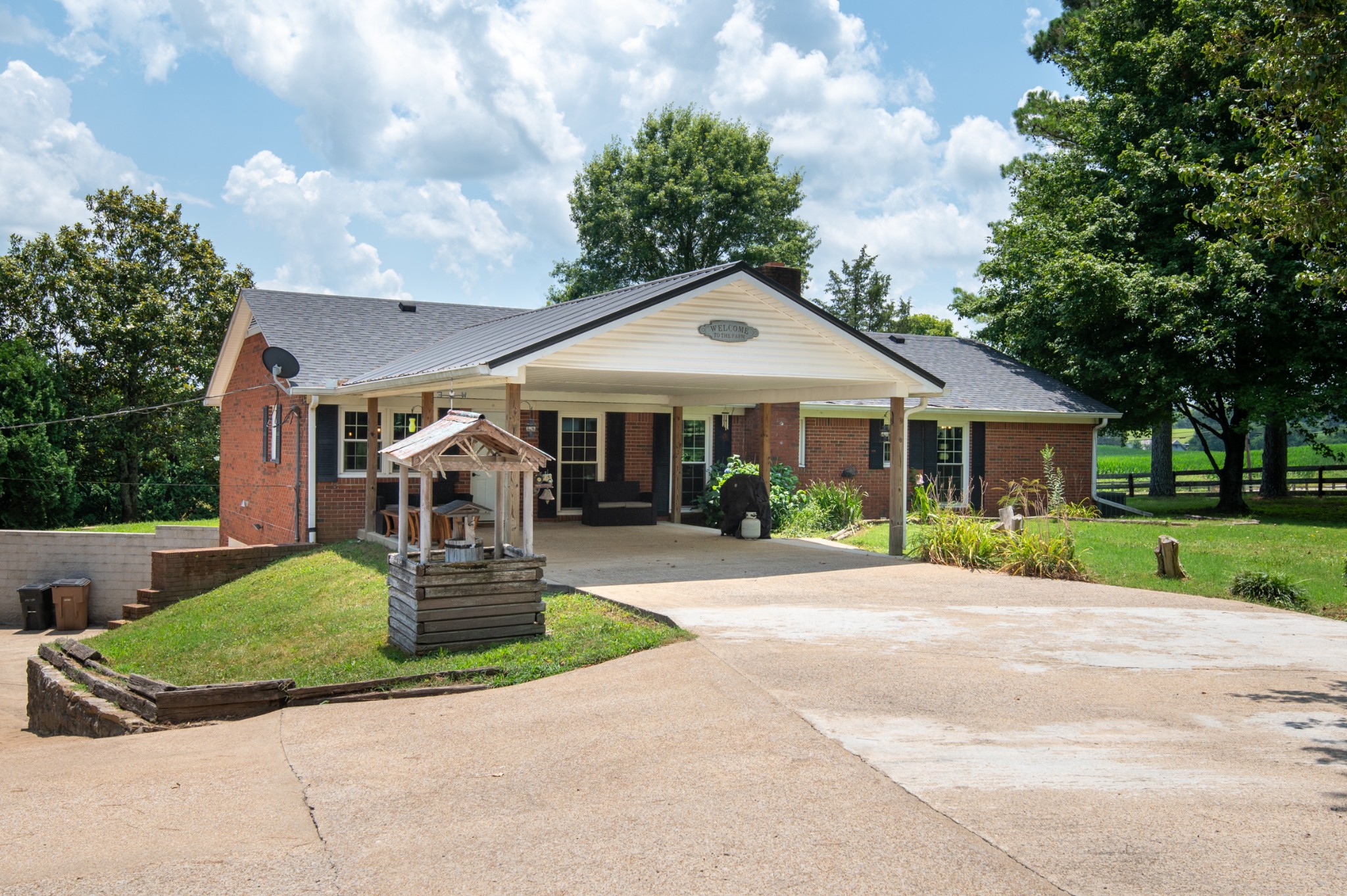 719 Waco Road Lynnville, TN 38472 - Photo 44 of 67 a front view of a house with a yard and garage