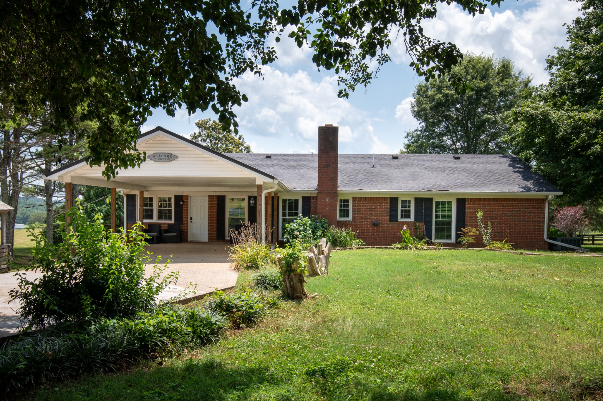 719 Waco Road Lynnville, TN 38472 - Photo 45 of 67 a front view of a house with a garden
