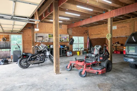 an aerial view of residential houses with outdoor space and river