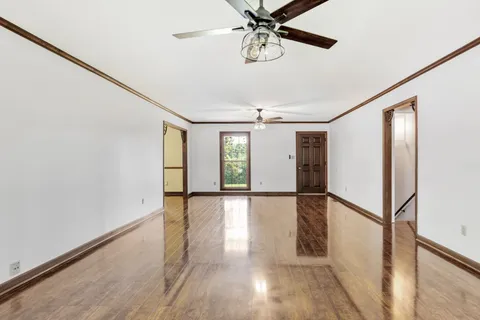a view of an entryway with wooden floor