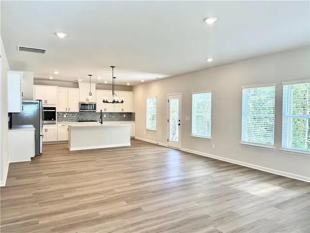 a view of kitchen with wooden floor
