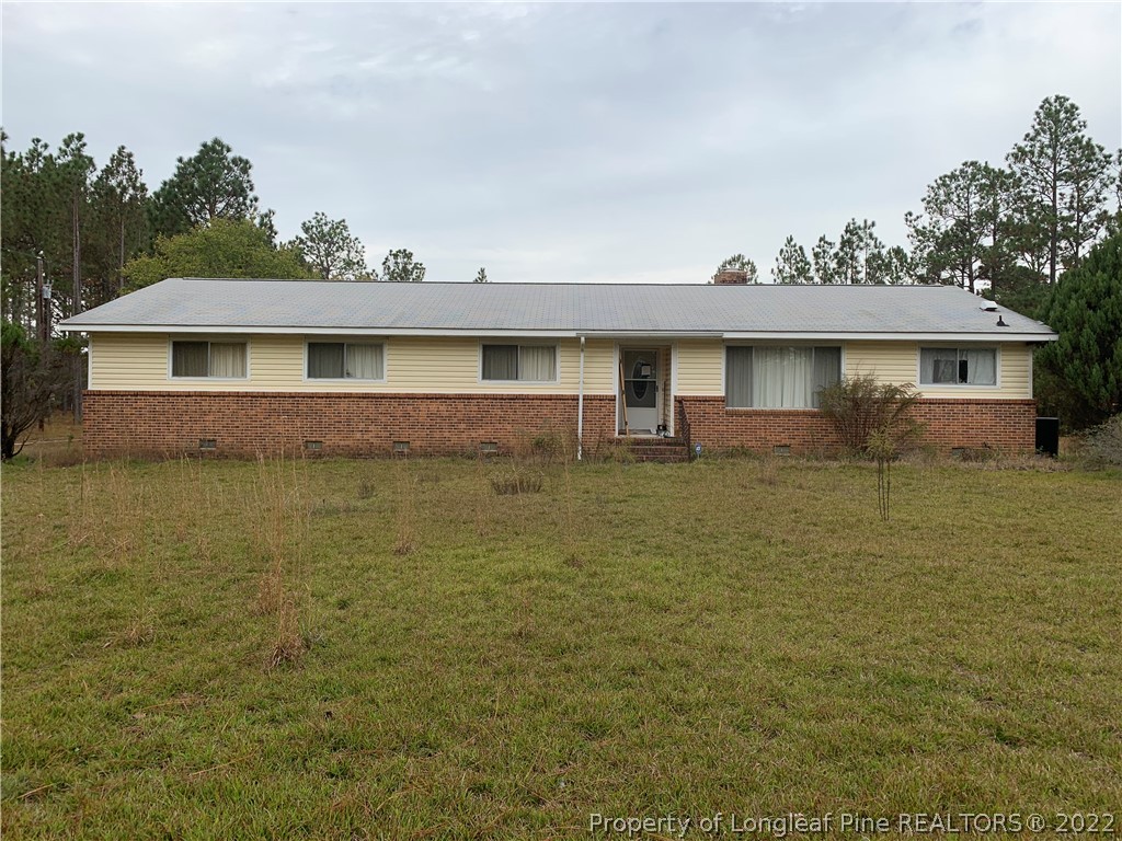 350 Horseshoe Road Aberdeen, NC 28315 - Photo 1 of 47 a front view of a house with a yard