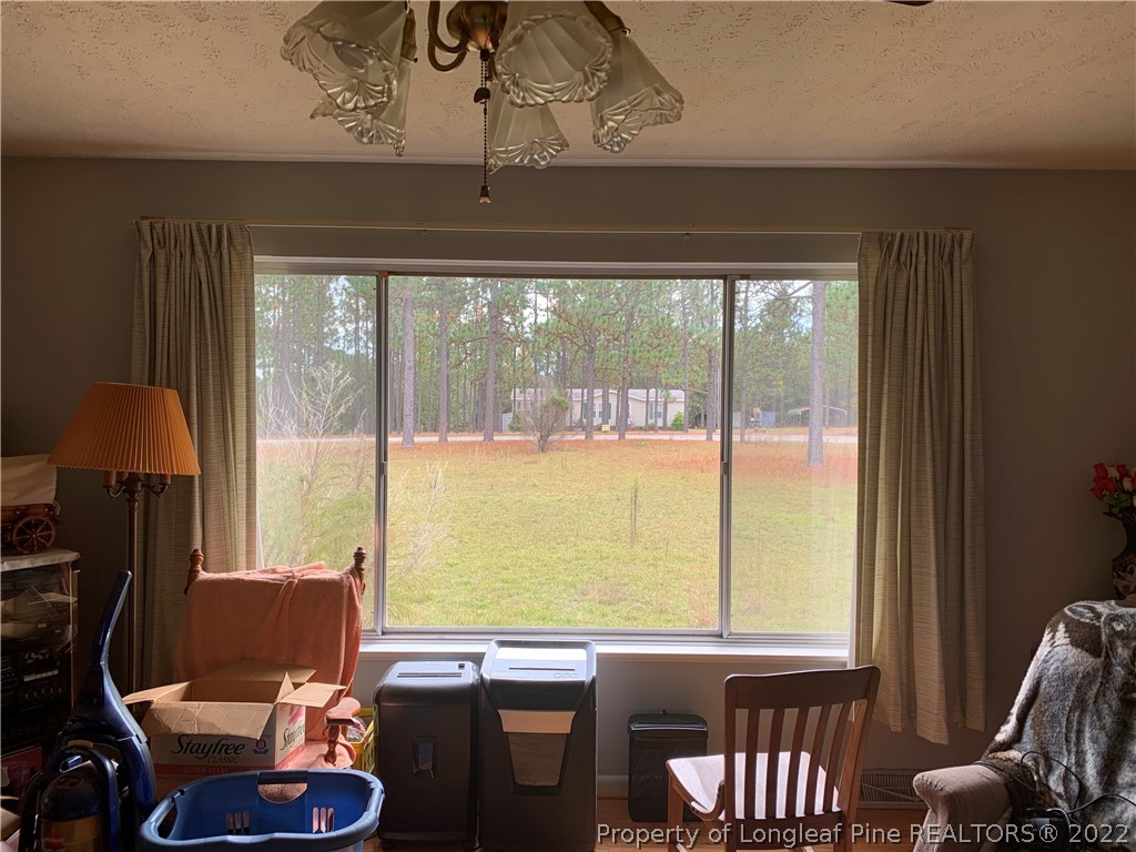 350 Horseshoe Road Aberdeen, NC 28315 - Photo 13 of 47 a room with furniture and a window