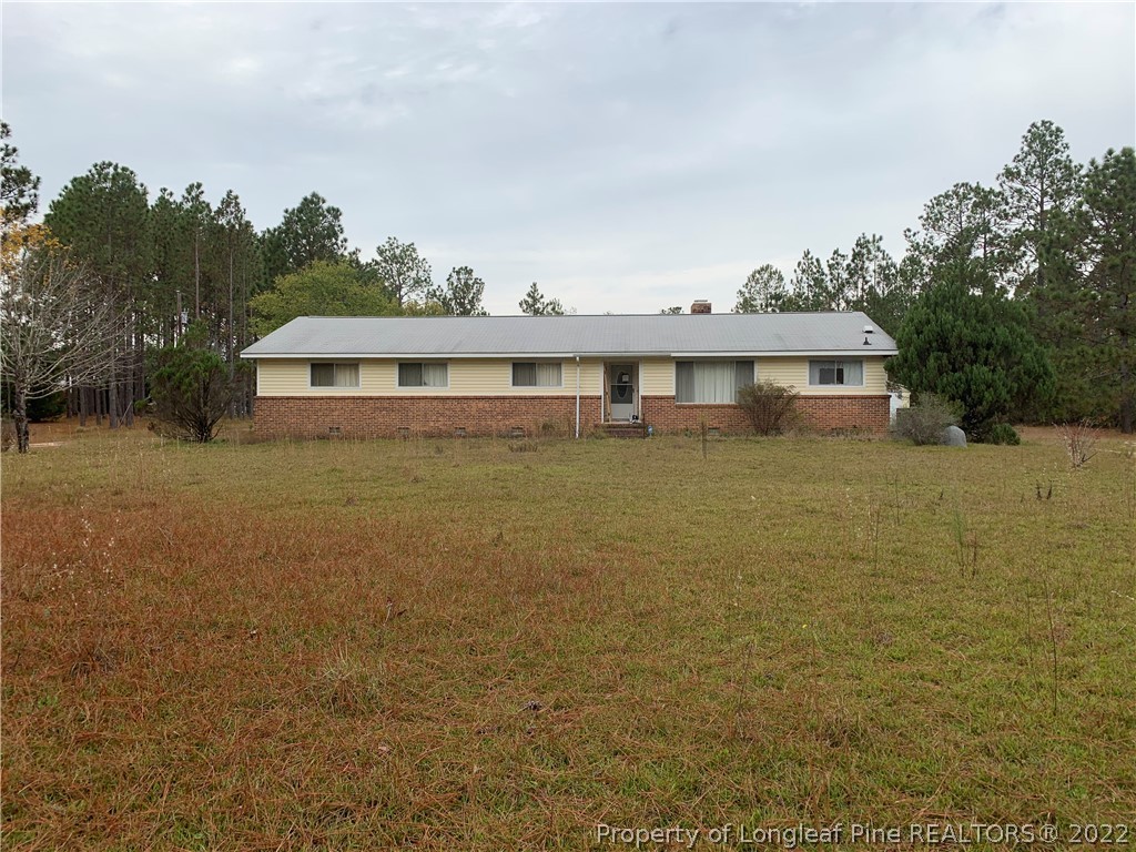 350 Horseshoe Road Aberdeen, NC 28315 - Photo 2 of 47 a view of a house with yard and lake view