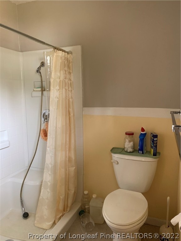 350 Horseshoe Road Aberdeen, NC 28315 - Photo 21 of 47 a bathroom with a toilet and a shower