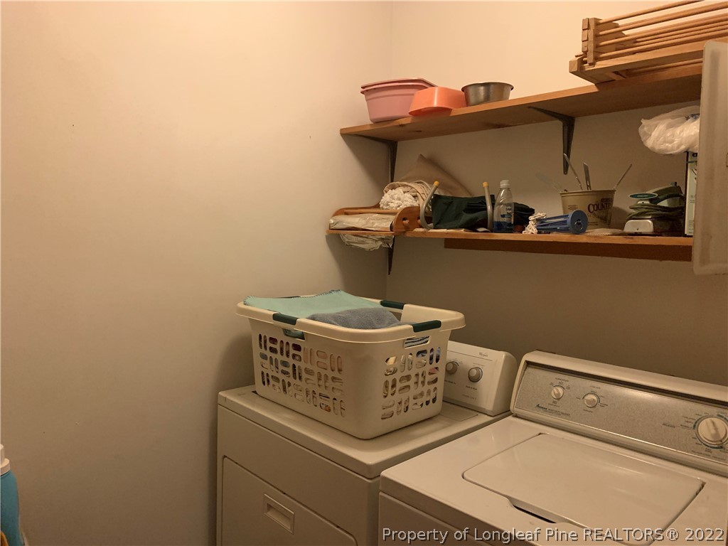 350 Horseshoe Road Aberdeen, NC 28315 - Photo 22 of 47 a utility room with dryer and washer