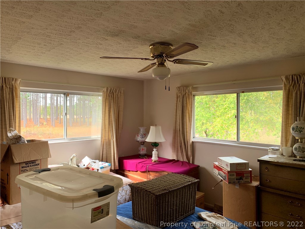 350 Horseshoe Road Aberdeen, NC 28315 - Photo 24 of 47 a living room with furniture and a window